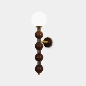 Selene beaded globe wall sconce with frosted glass shade and brass hardware, front view on white backdrop