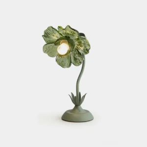 Selmira green glass table lamp with ribbed flower-shaped shade and metal leaf base, front view on white background