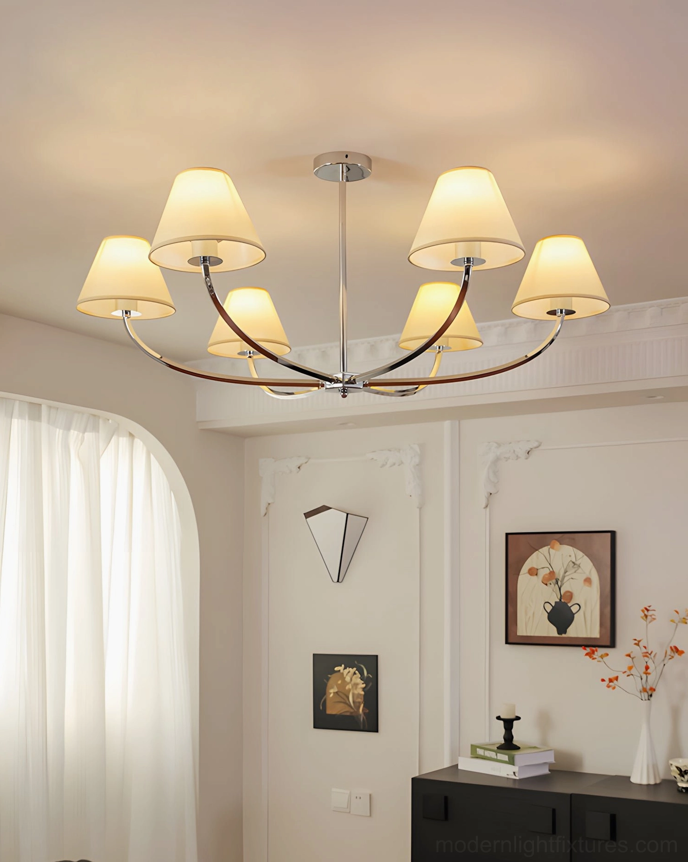 Selmont curved arm chandelier with bronze metal frame and beige fabric shades in neutral home accent corner