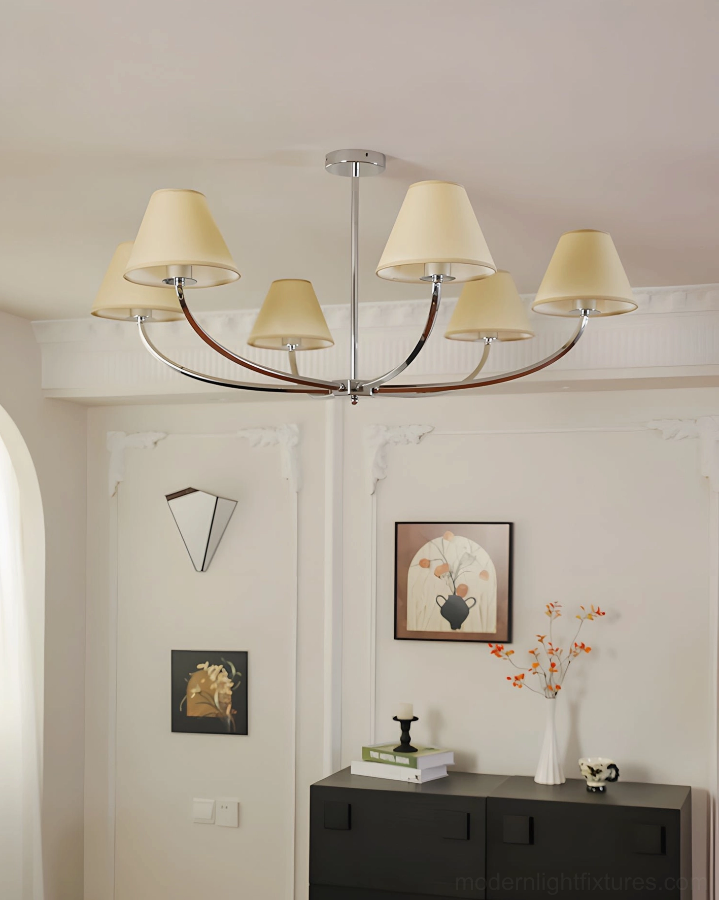 6-light curved arm chandelier with dark polished metal frame and beige fabric lampshades in entryway accent wall