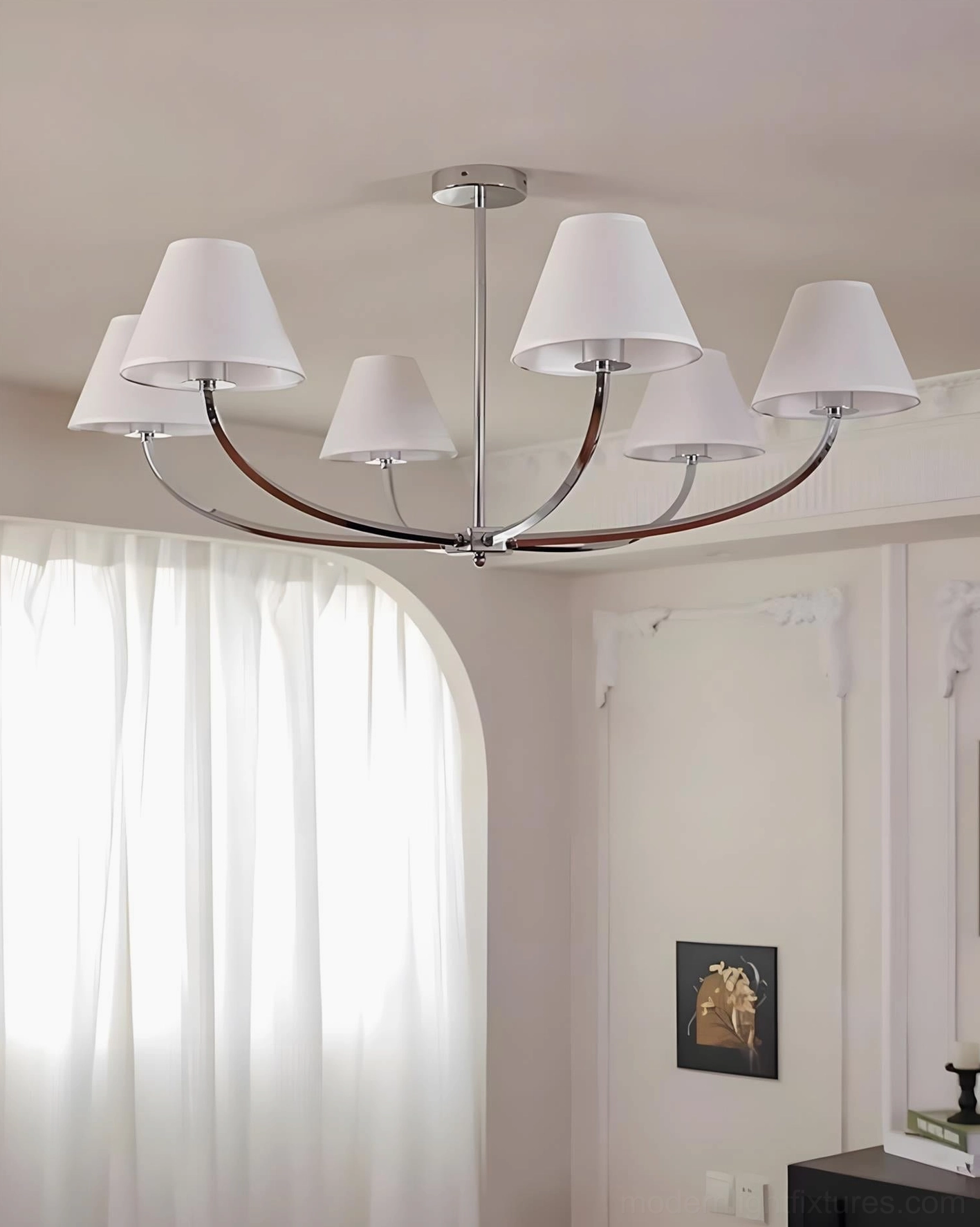 Selmont 6-light modern chandelier installed in transitional style dining room with elegant table setting