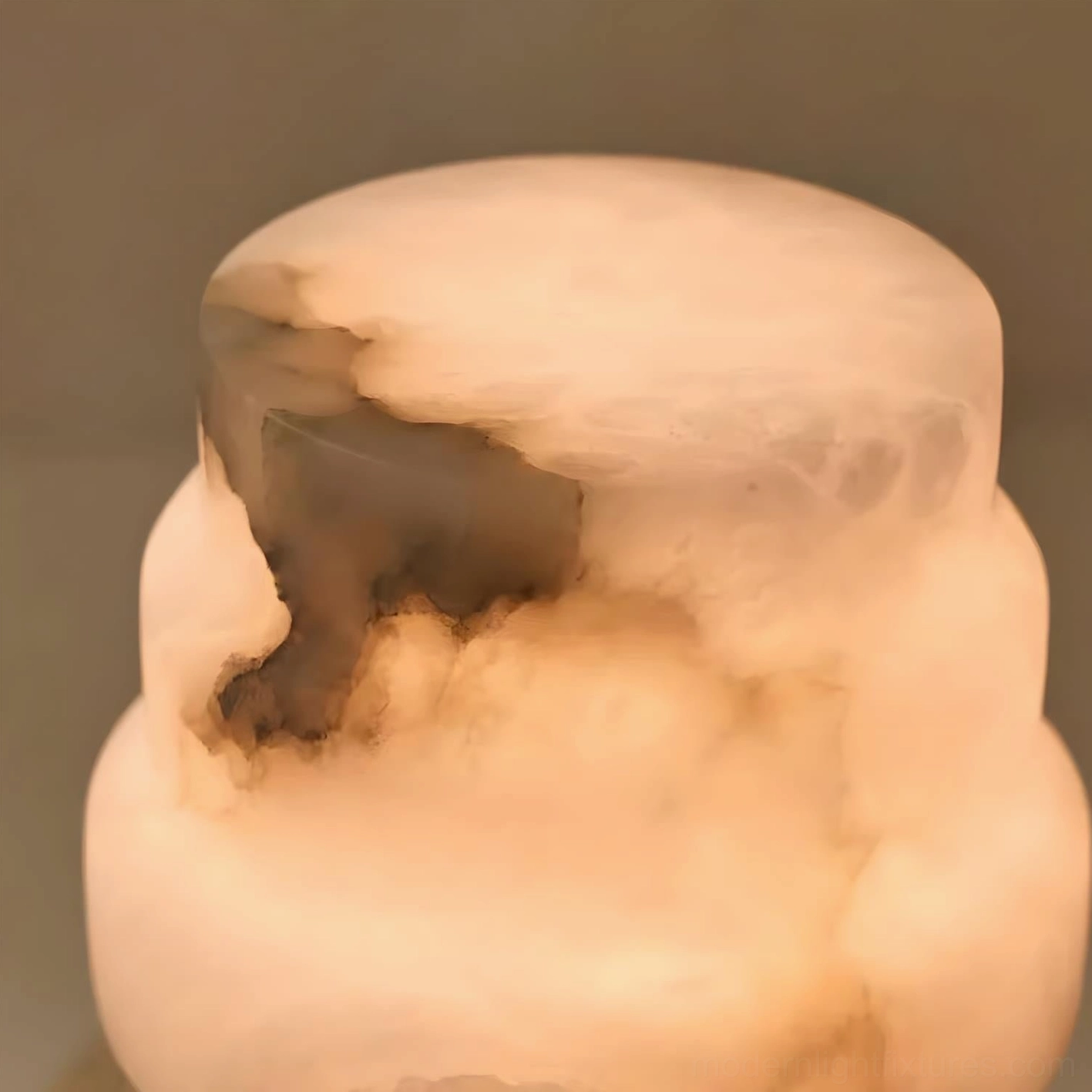 Illuminated selmora alabaster table lamp macro close-up showing glowing warm light through natural stone veins