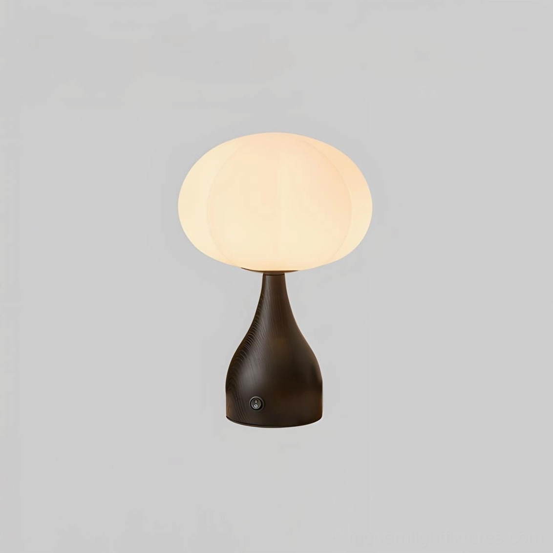 Model B table lamp - medium-height sculptural fixture with globe shade on standard nightstand