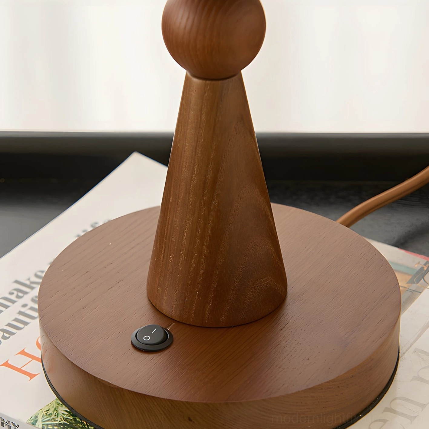 Layered petal-inspired glass shade table lamp with warm ambient glow and natural wood base