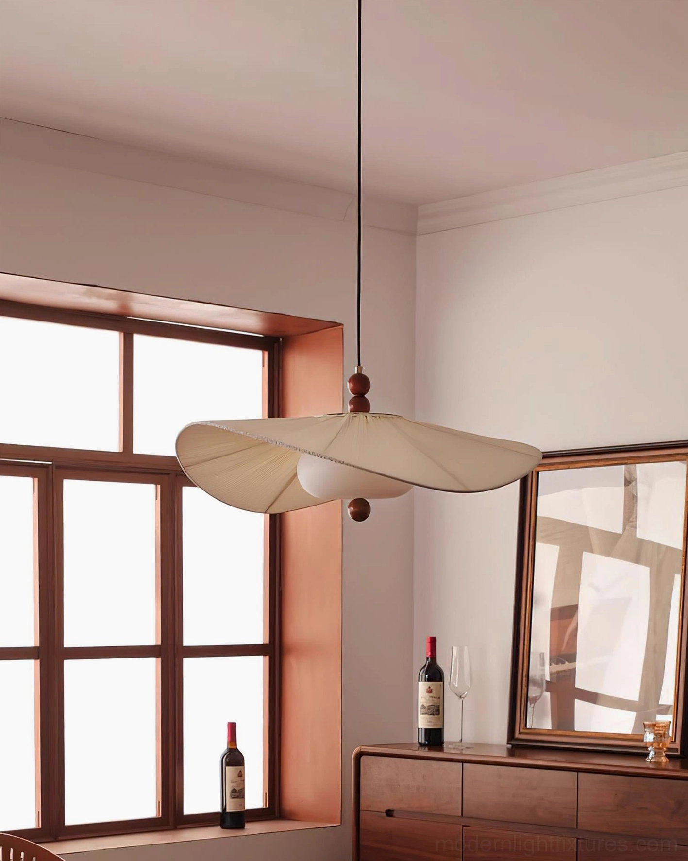 Serafina pleated pendant light side view in residential home with wood-framed window and vintage cabinet, botanical interior design