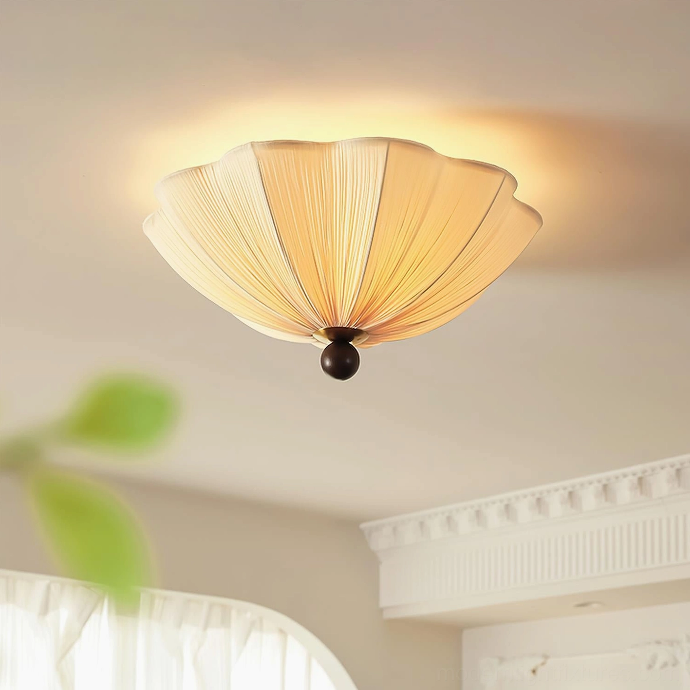 Seralyn modern flush mount ceiling light mounted overhead in French-style residential interior, warm beige pleated shade with dark metal base creating ambient lighting