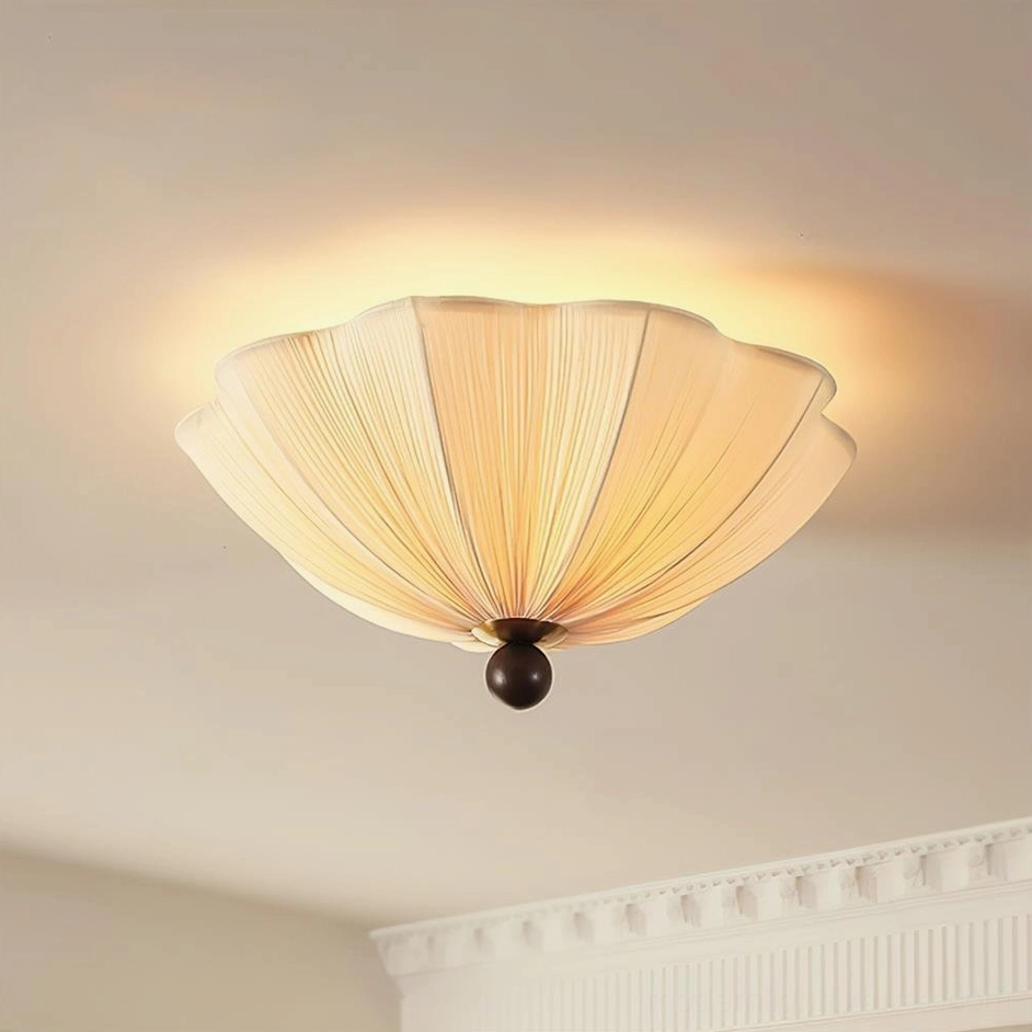 Seralyn scalloped fabric ceiling lamp side view installed on crown molding ceiling, showing detailed pleated shade and spherical base design