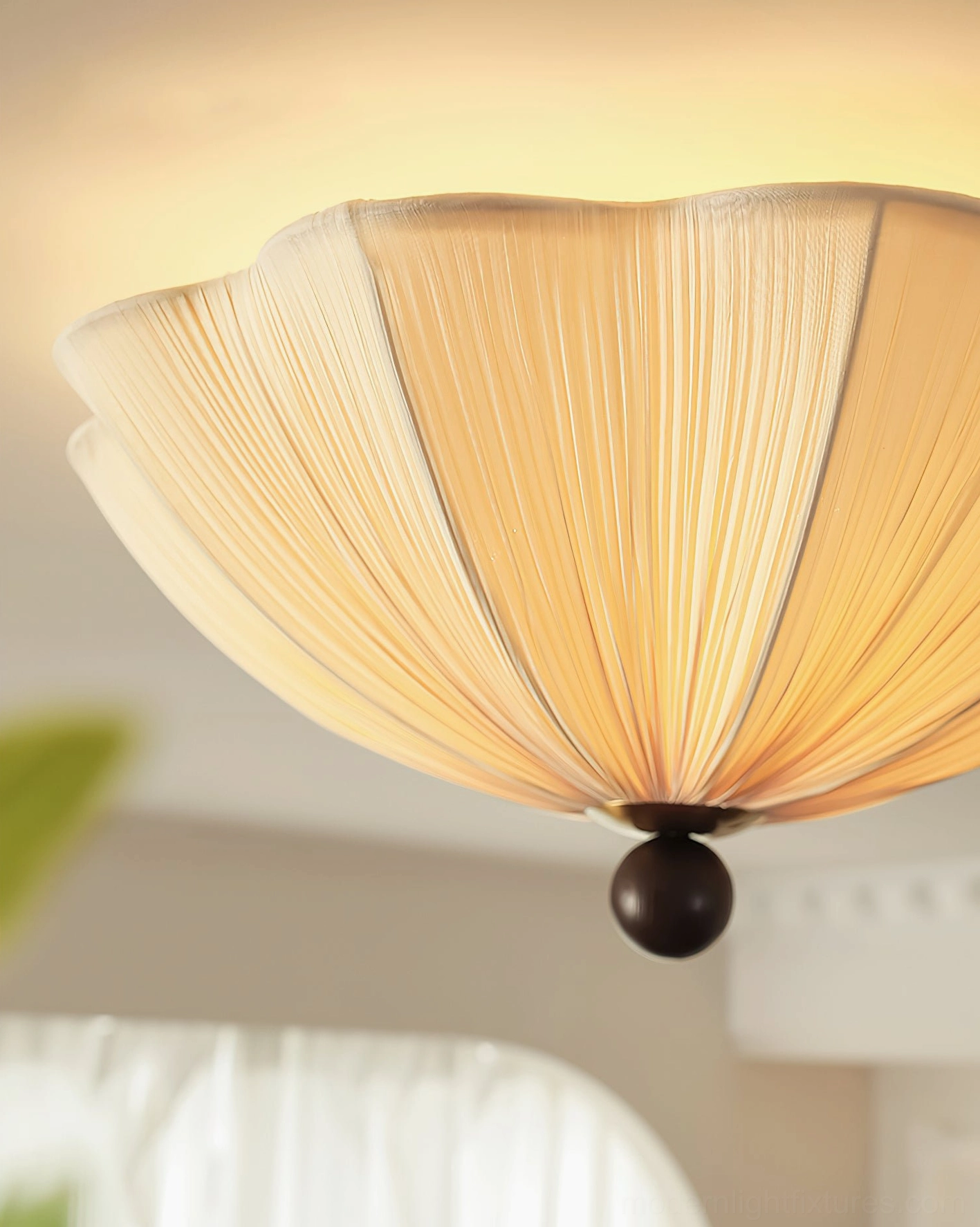Close-up detailed view of Seralyn pleated ceiling light showing intricate fabric pleat texture and warm beige color in residential setting