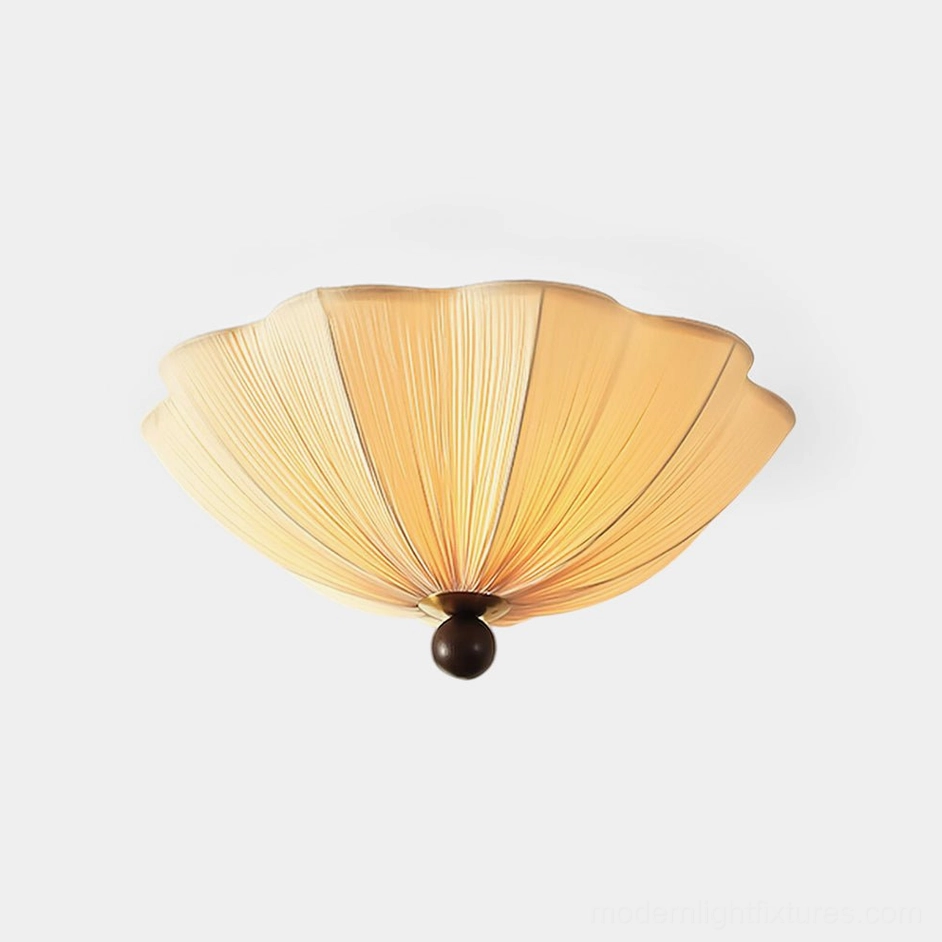 Seralyn pleated fabric ceiling light with scalloped shade design, front view against white background showing warm beige fabric and dark spherical base