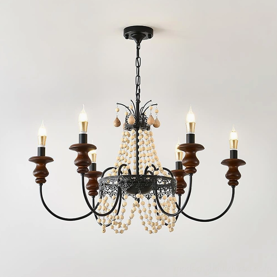 Eight-arm vintage Seraphine beaded chandelier frontal flat view showcasing black metal wrought iron, wooden candle holders, and hanging pearl beads