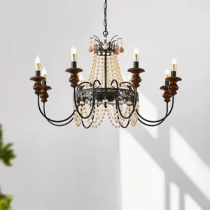 Seraphine farmhouse chandelier in sunlit interior setting showcasing wrought iron structure, wooden candle sleeves, and pearl bead tassels