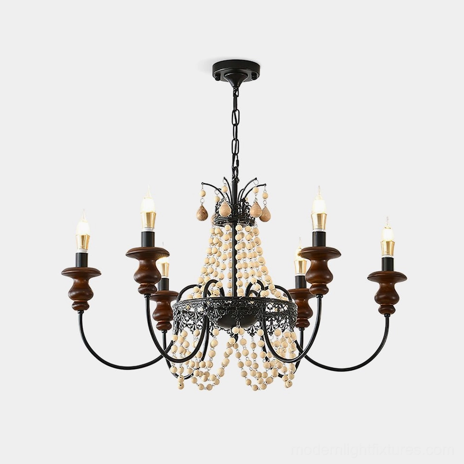 Seraphine rustic beaded chandelier overhead studio view featuring black iron frame with walnut wood candle caps and cascading cream pearl beads