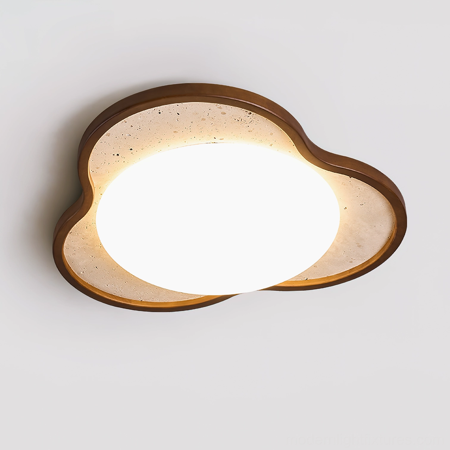 Seraphis ceiling light fixture showing frosted diffuser and warm ambient glow