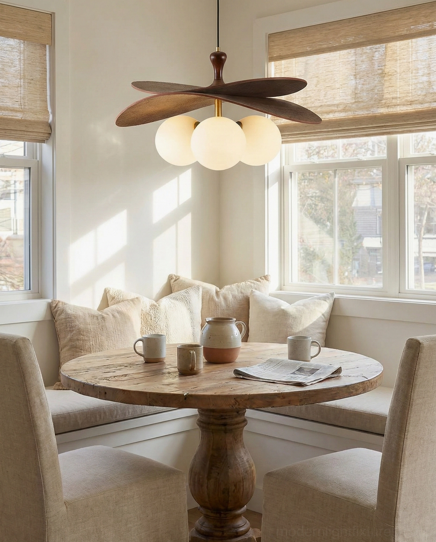 Seraphis wooden pendant light suspended in warm breakfast nook with natural daylight and rustic decor