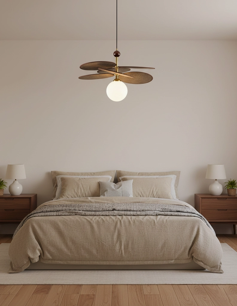 Seraphis pendant light illuminated in contemporary living space above dining table with warm glow