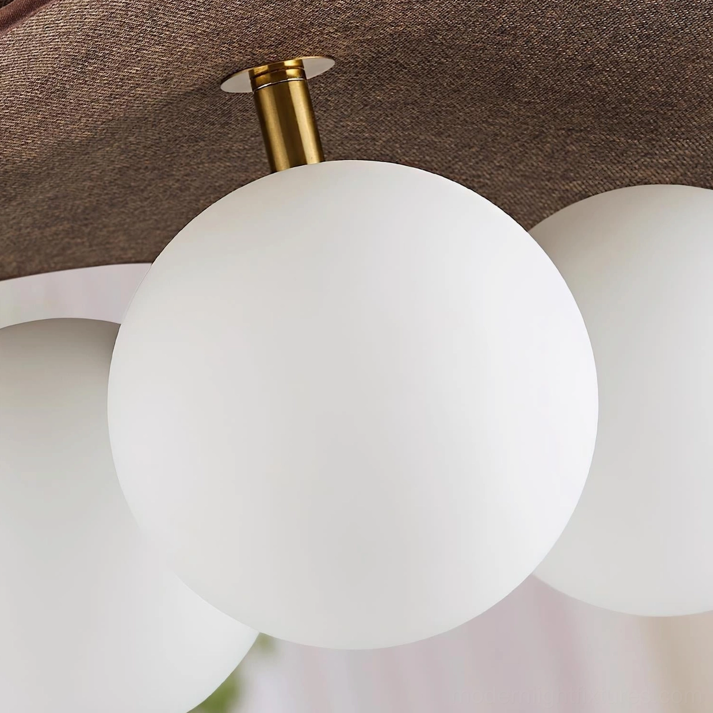 Seraphis pendant light fixture displayed in styled interior with modern furniture and neutral palette