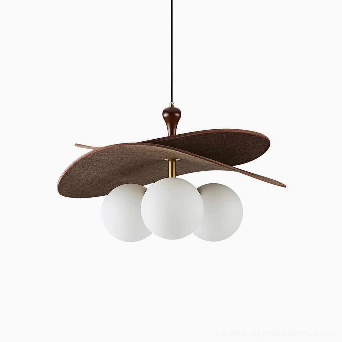Three-globe Seraphis pendant light in walnut finish creating dramatic shadow patterns in dining space