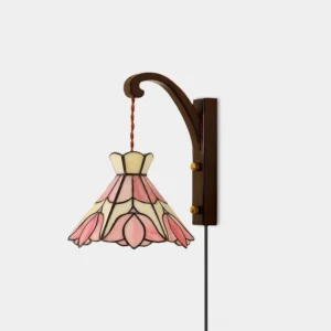 Serena Tiffany hand-cut stained glass plug-in wall sconce with pink floral shade and walnut wood body - front view