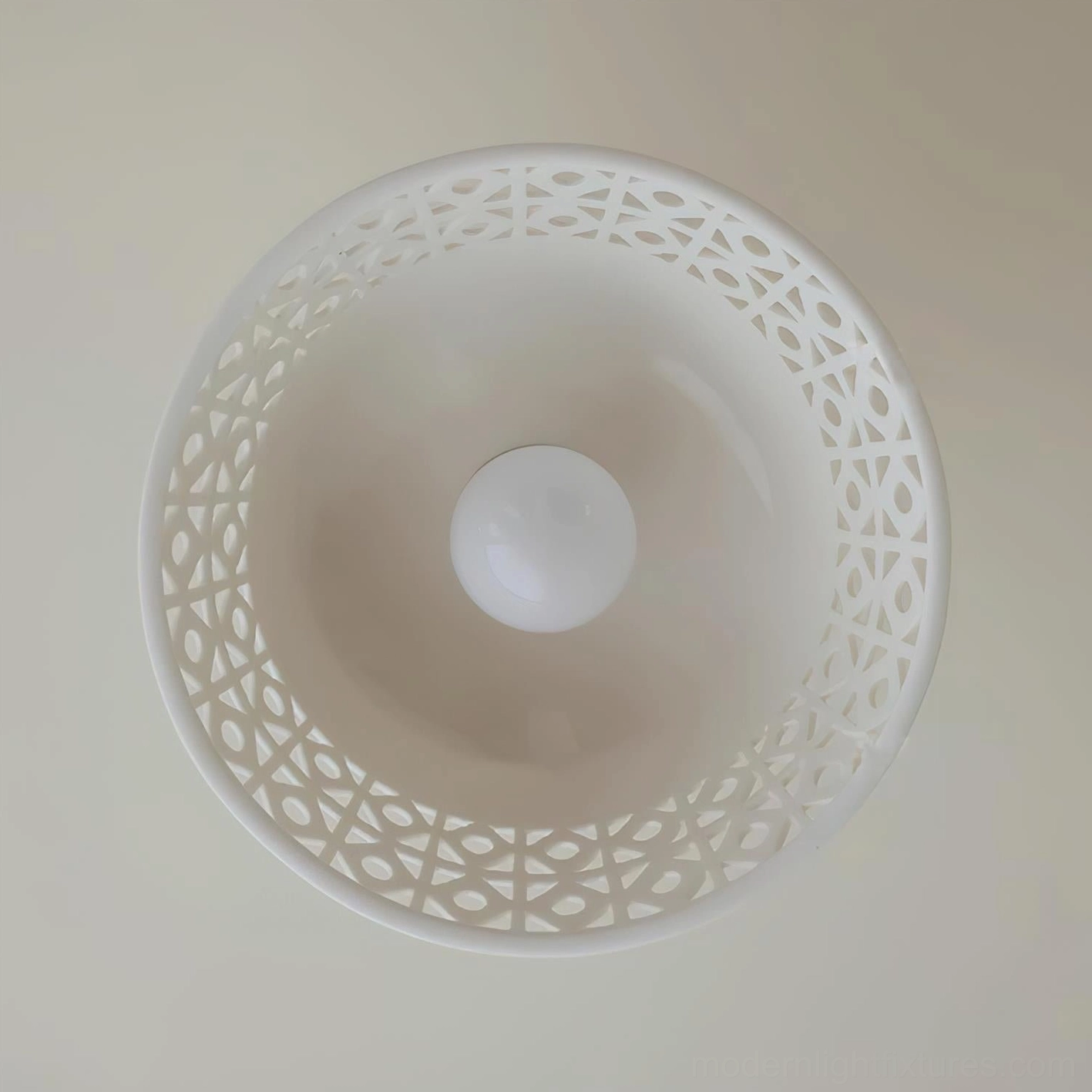 Serene ceiling light fixture with intricate ceramic detailing and contemporary minimalist aesthetic