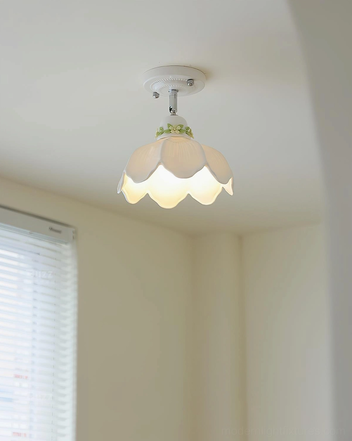 Serene ceramic ceiling lamp with floral trim and warm light glow creating tranquil ambiance