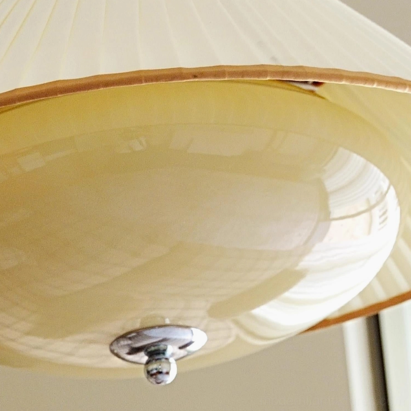 Serenique vintage pendant light assembly, metal hanging loop and brass fixture joint detail