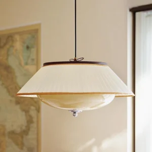 Serenique vintage pendant light in living room, three-quarter angle showing warm ambient light