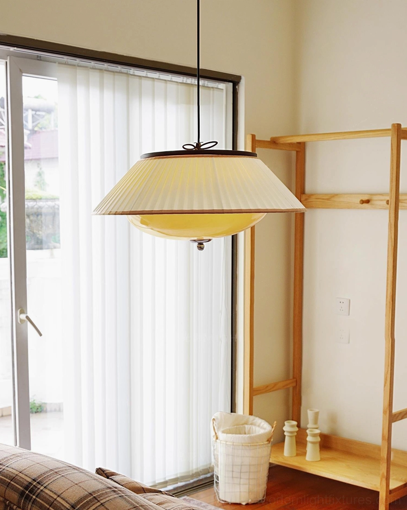Serenique pendant lamp installed in living room with wooden decor and natural light