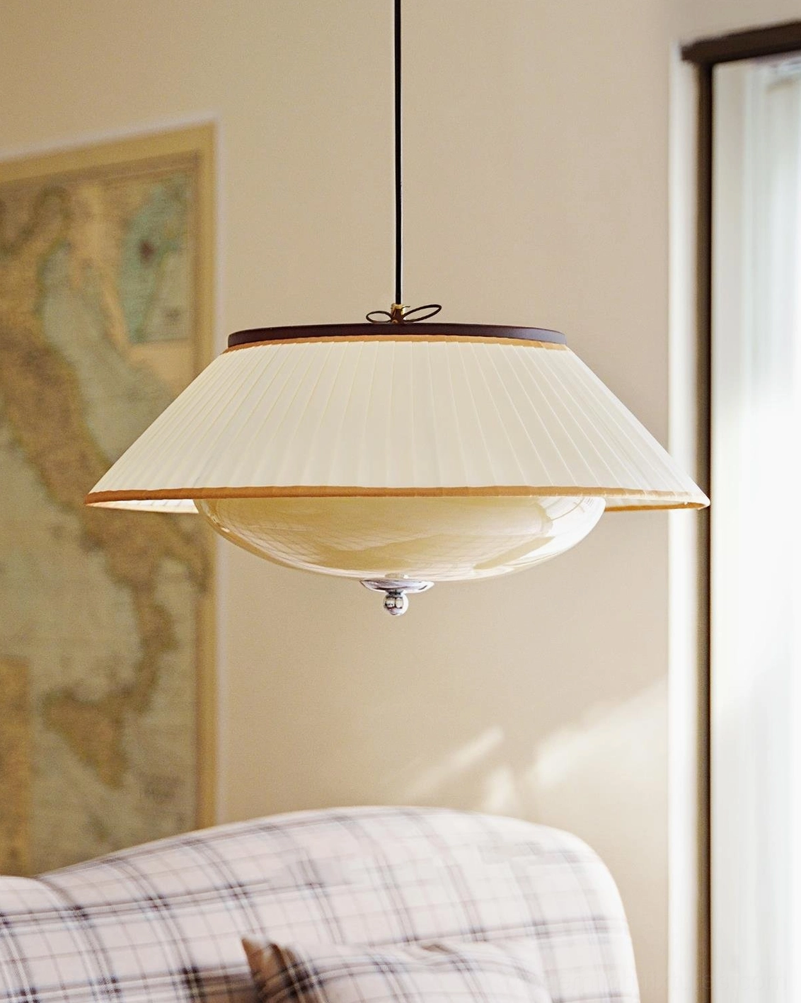Serenique pendant lamp low side angle detail, pleated fabric shade and chrome metal fixture