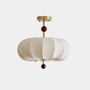 Serenity modern fabric ceiling light with pumpkin-shaped shade, brass hardware and wooden sphere accents - frontal studio view