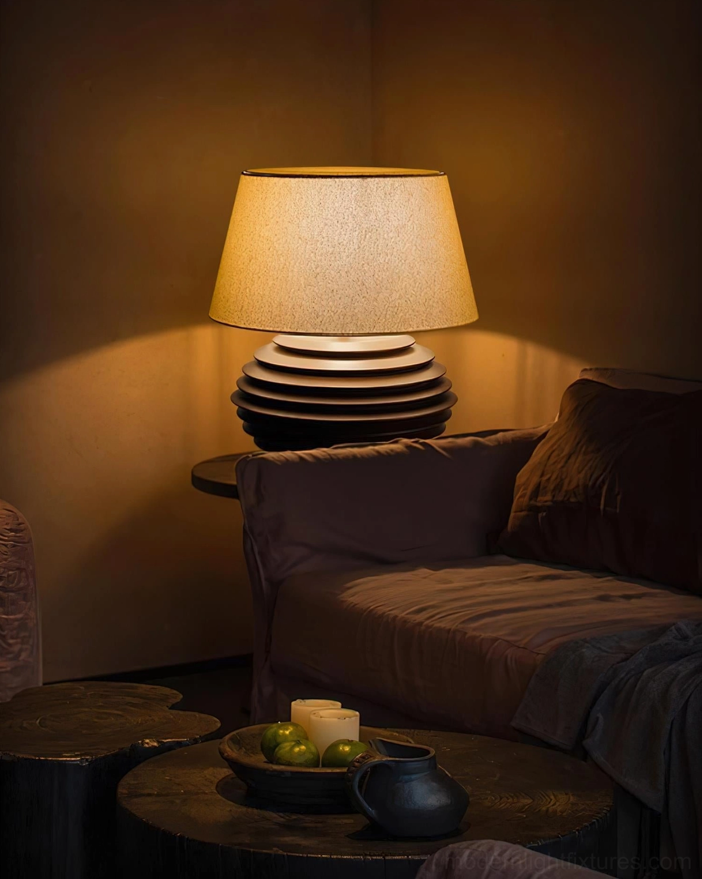 Serenity Strata table lamp with warm tapered fabric shade showing light diffusion and ambient glow from cotton-linen blend material