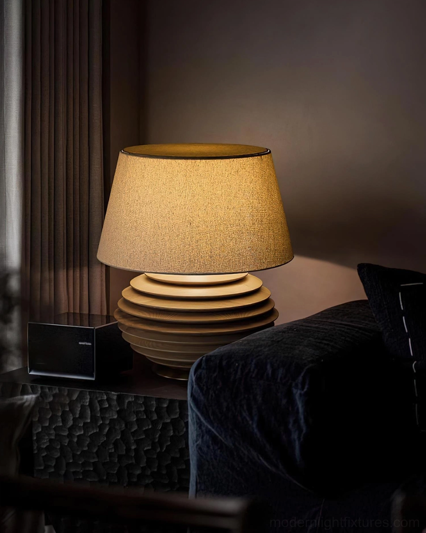 Serenity Strata table lamp brown ribbed base on dark textured side cabinet, three-quarter side view in sophisticated dark living room lighting design