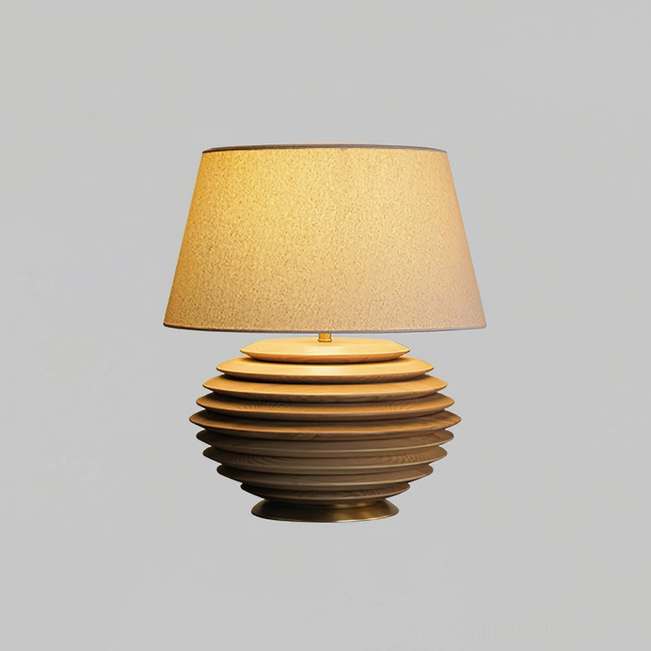 Serenity Strata table lamp wood color finish variant displayed on dark wood dresser in vintage study, three-quarter front angle