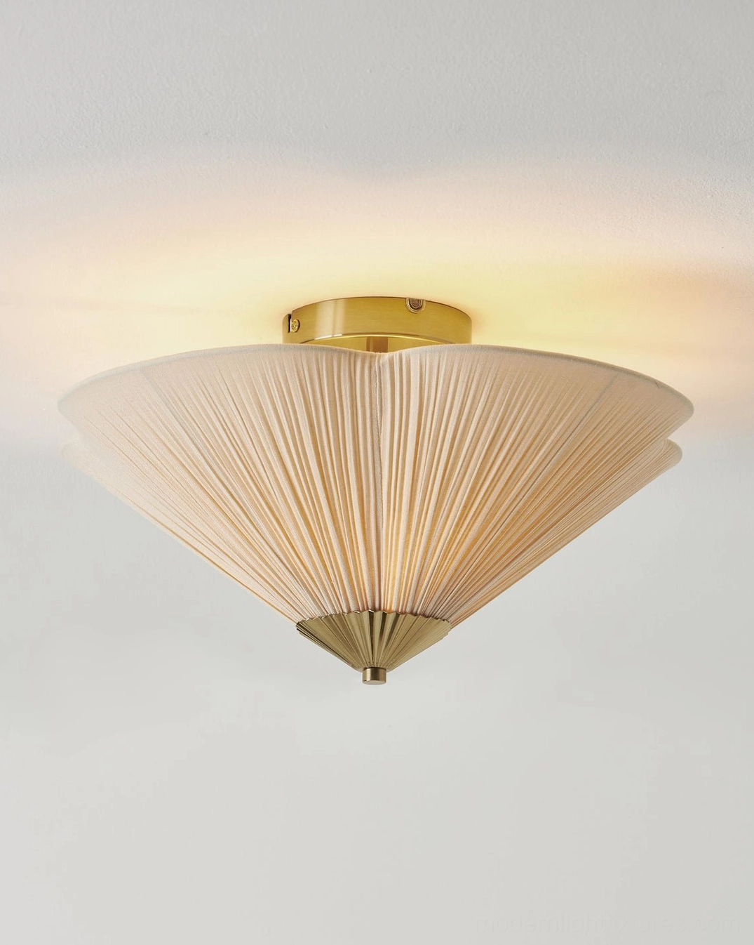 Seretta pleated cone ceiling lamp low angle front view with clear linen pleats and brass base