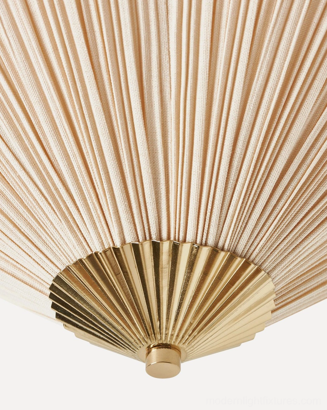 Seretta ceiling light fixture detail showing hand-pleated ivory linen and warm gold metal components