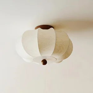 Serica ceiling lamp fixture showing beige floral pattern fabric shade and walnut wood base detail, side angle view