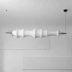 Serika chandelier three-quarter side profile showing segmented folded fabric design and black metal fixtures
