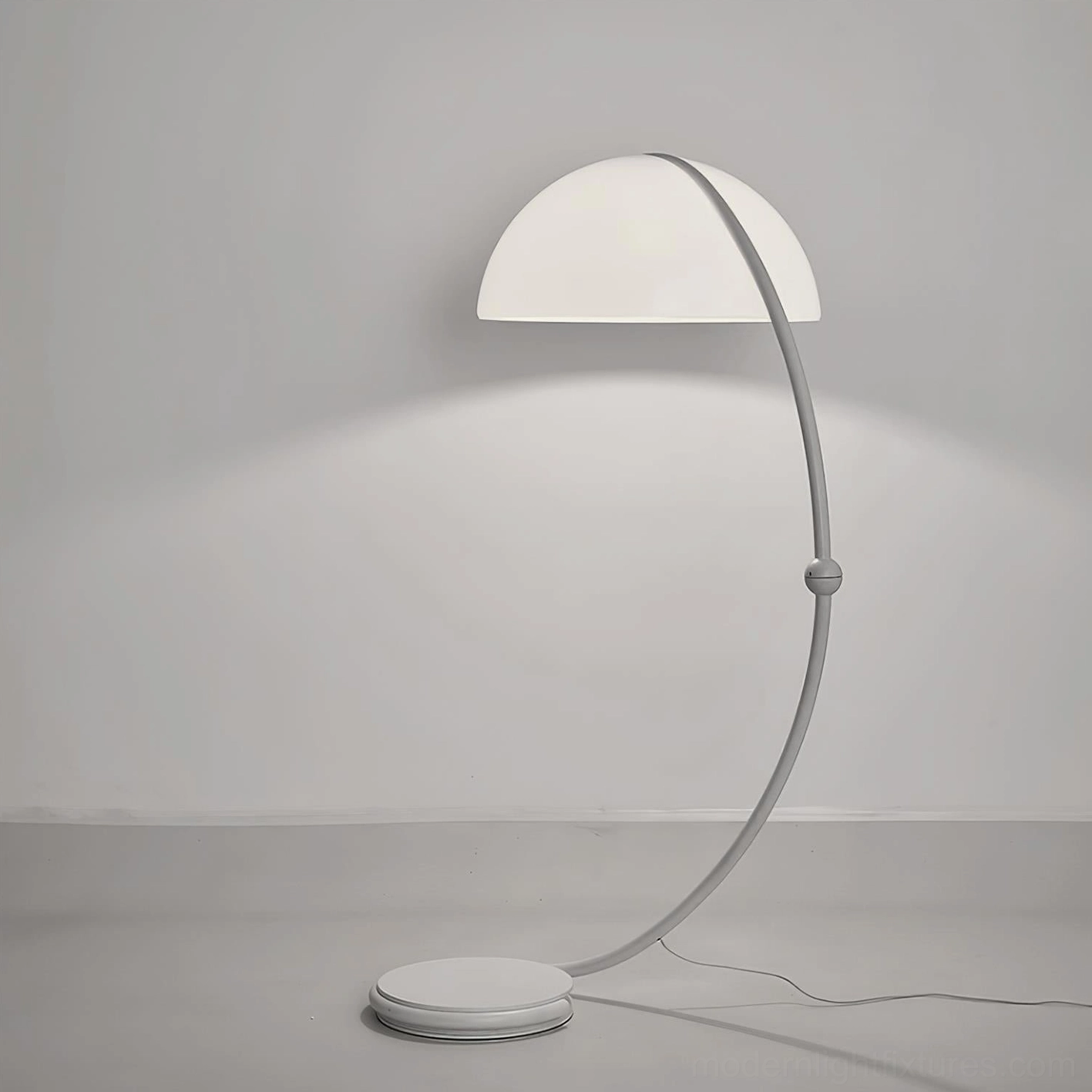 White Serpente articulated floor lamp creating soft ambient glow in contemporary lounge