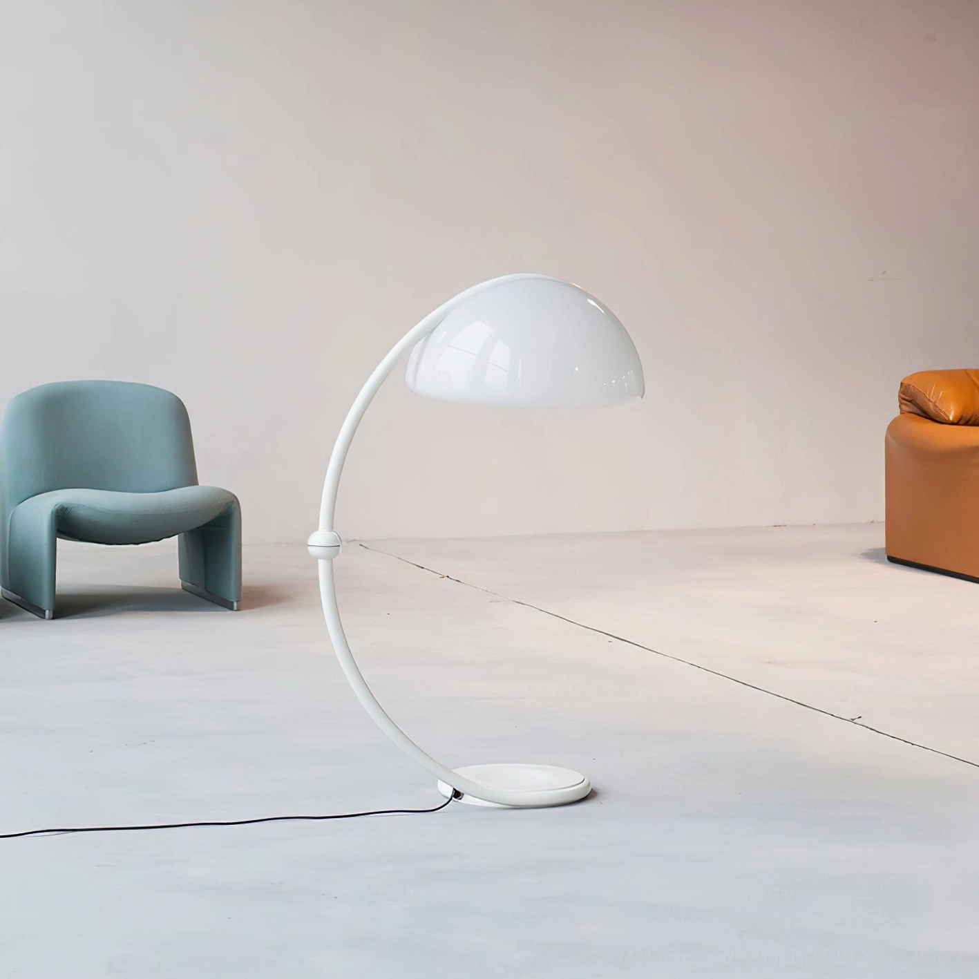 White Serpente articulated floor lamp in minimalist bright open space with teal and orange furniture