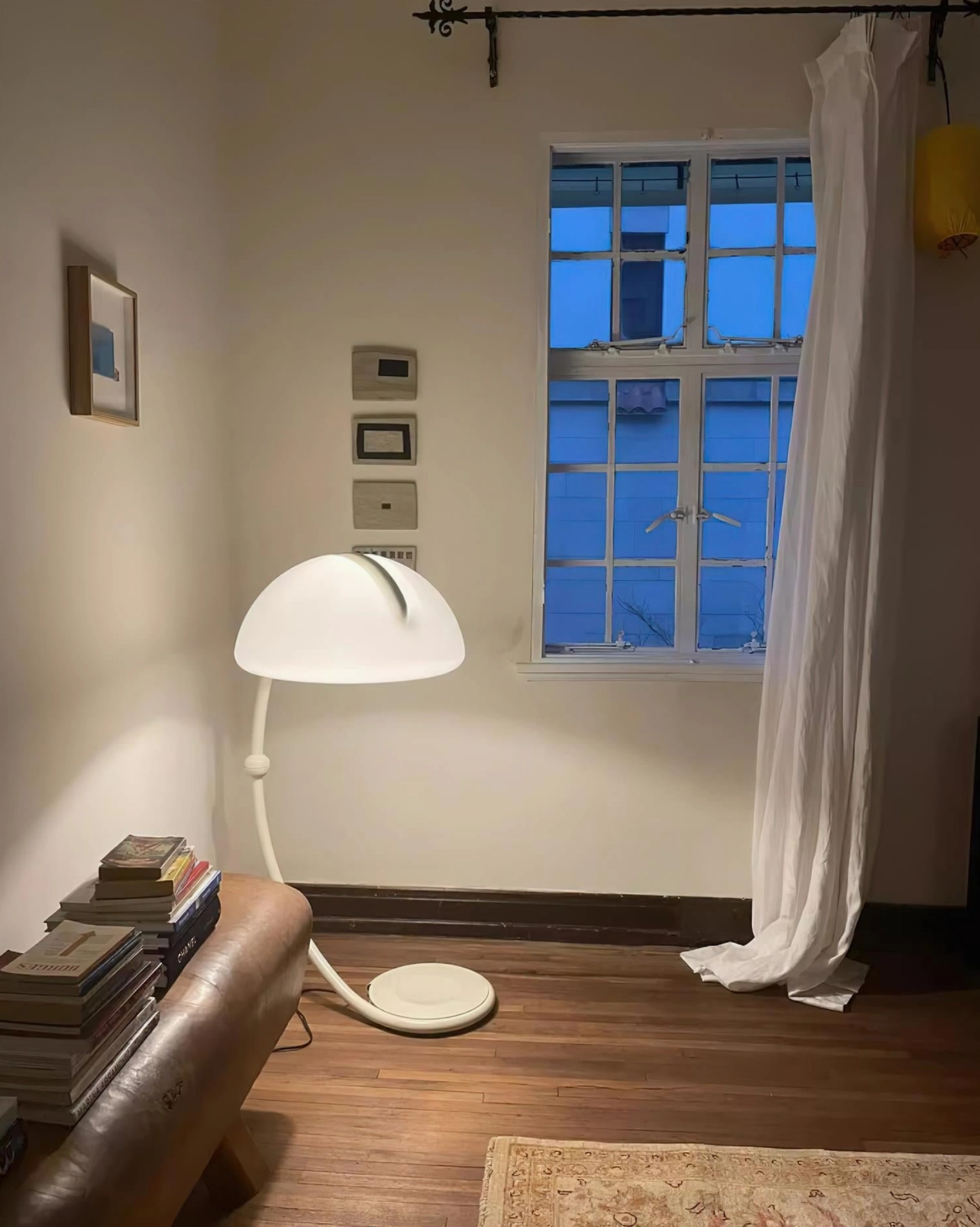 Serpente rotating floor lamp angled view demonstrating flexible shade positioning capabilities