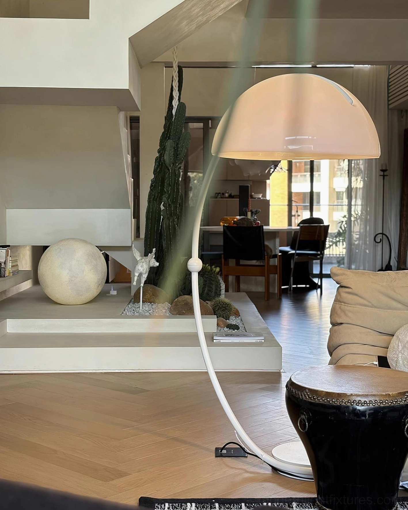 White Serpente rotating floor lamp in home office providing task lighting for workspace