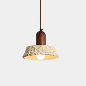 Shana carved resin pendant lamp with walnut wood fixture and intricate floral embossed shade, front overhead view on white background