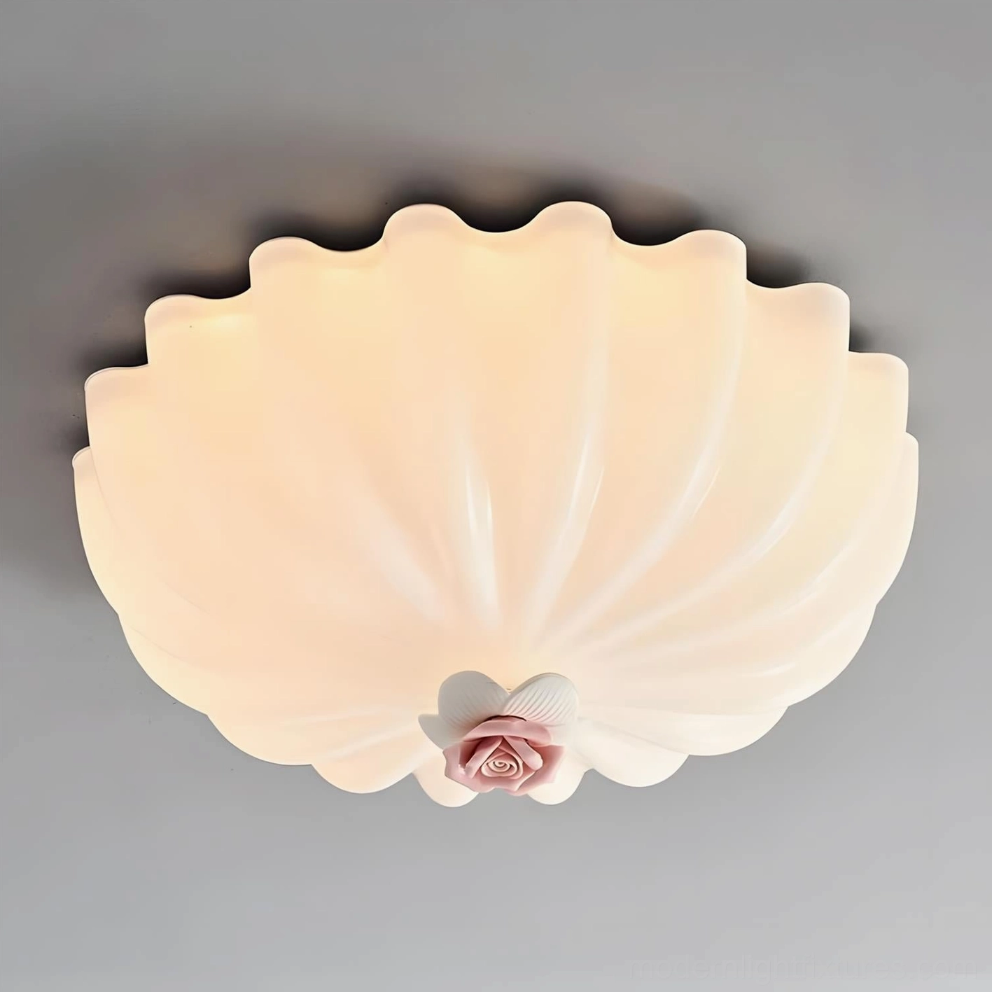 Detail shot of Belle Coquille ceiling lamp showcasing sculpted scalloped shell layers and precision craftsmanship in glass and ceramic