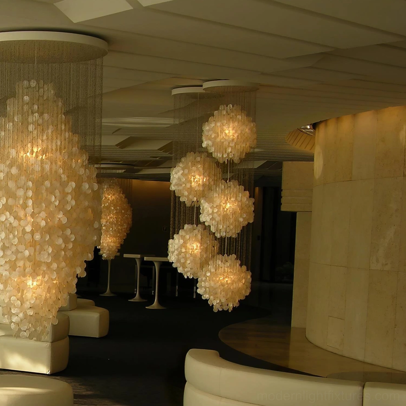 Modern shell chandelier in minimalist setting showcasing natural translucency and warm light diffusion properties