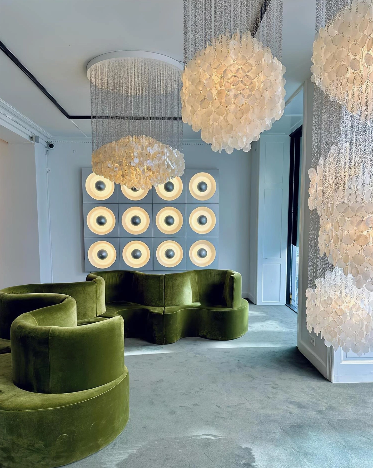 Shell cluster chandelier showing natural shell material texture and metal frame construction details
