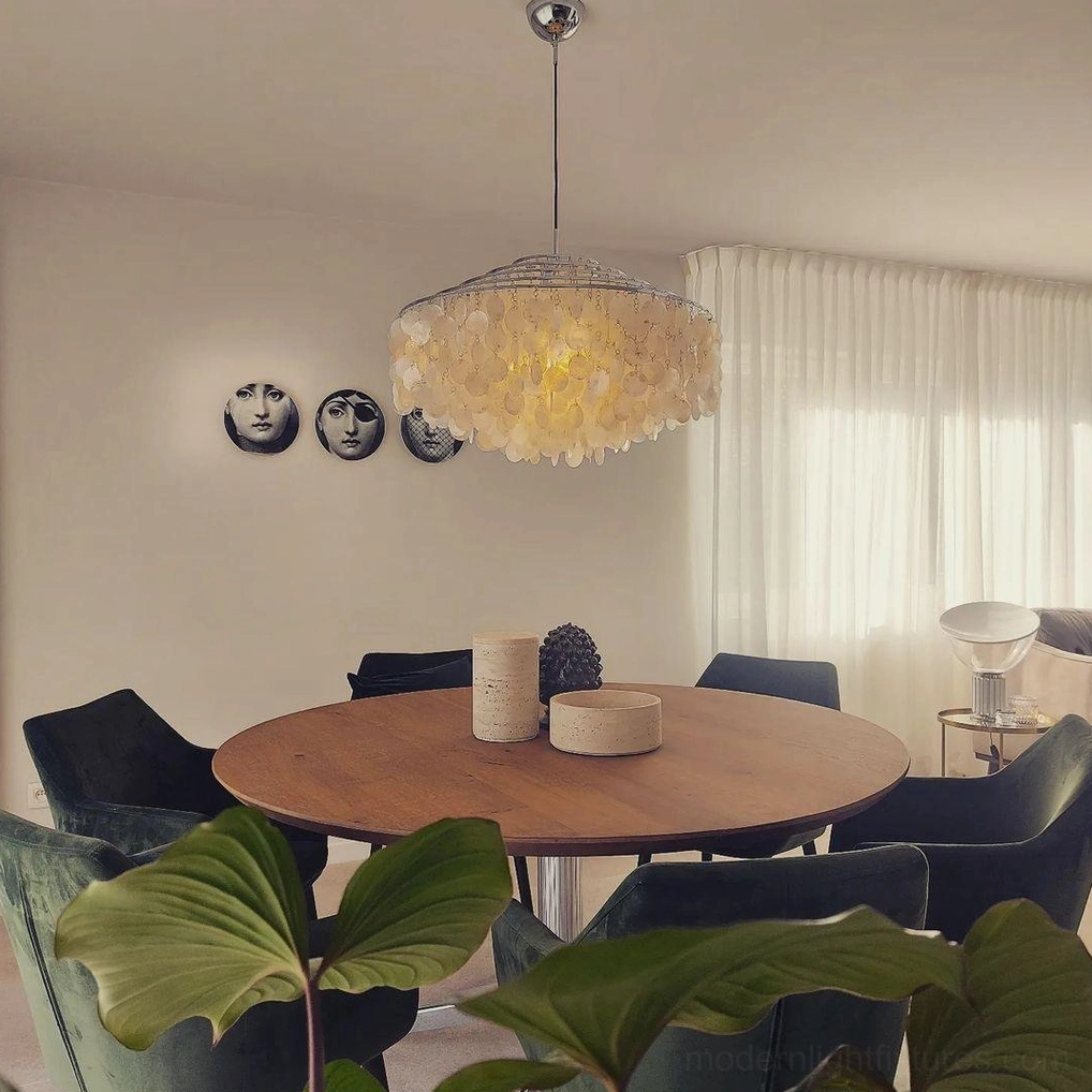Shell pendant light in modern dining room with warm ambient lighting, contemporary bohemian style