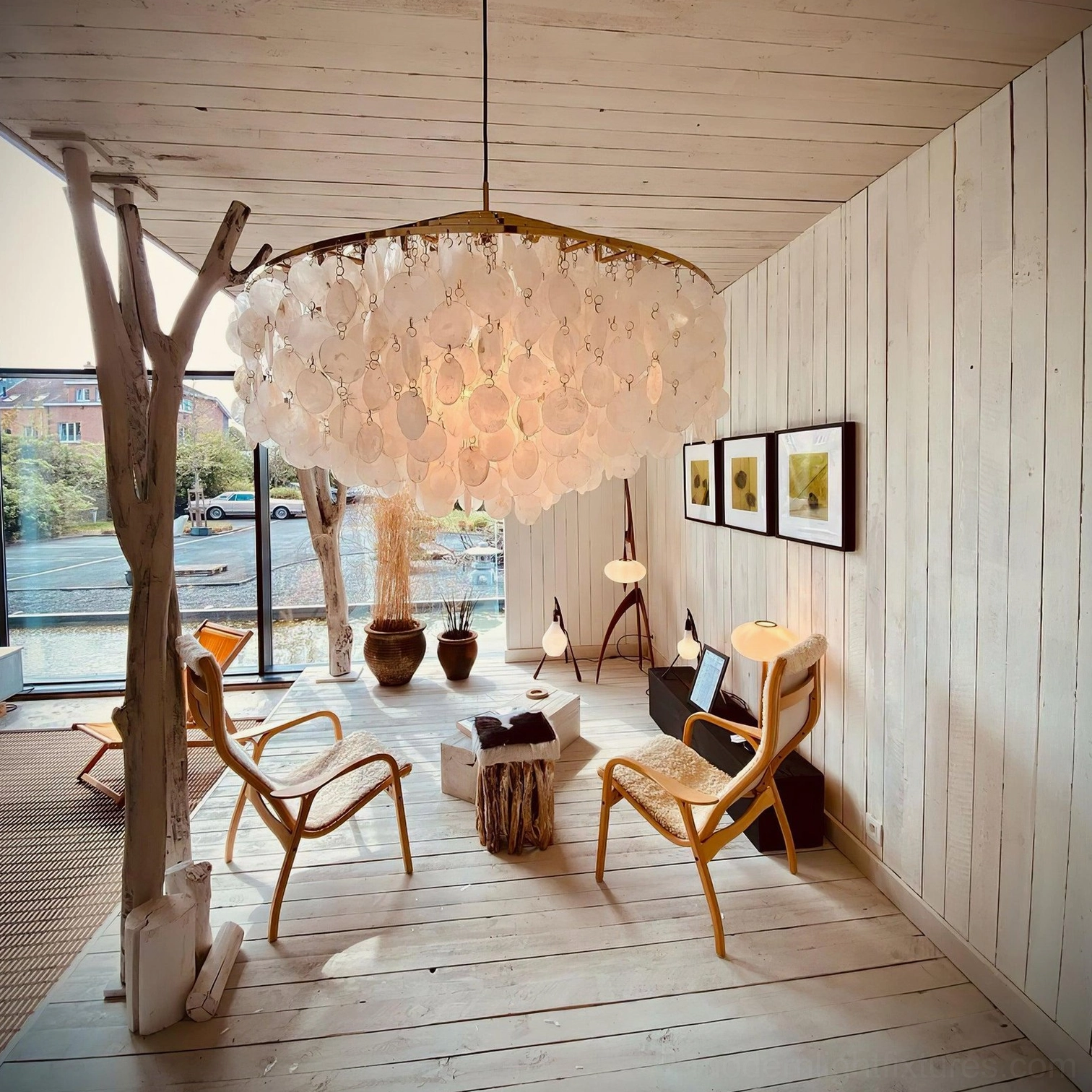 Modern shell pendant light fixture side angle view showing architectural shell arrangement