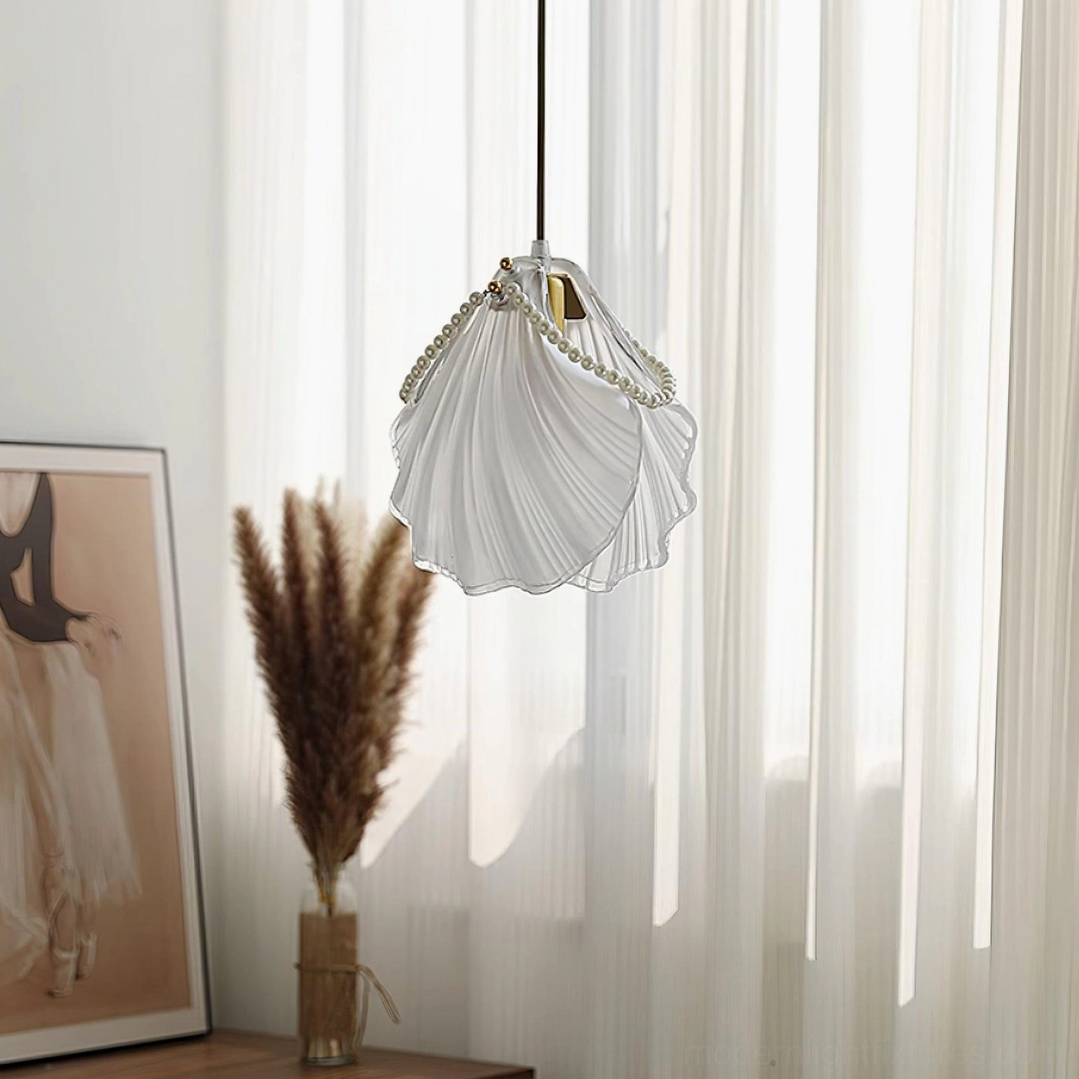 Side view of shell pendant light with semi-transparent frosted glass and minimal hanging setup