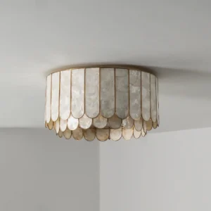 Shellora brass and white capiz shell ceiling light installed and glowing warm ambient light in modern home