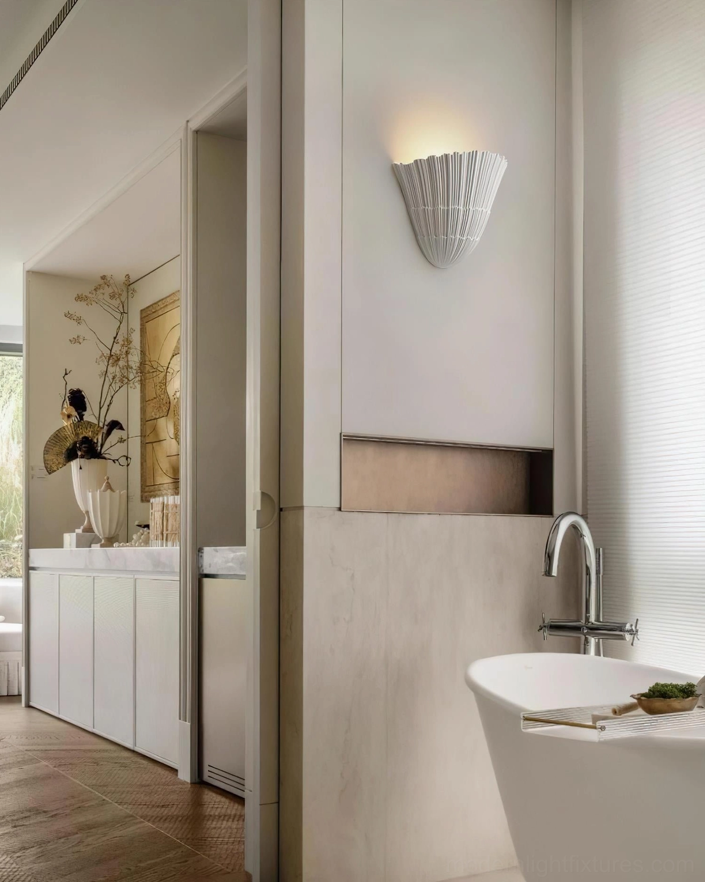Shellora wall sconce mounted above modern bathroom vanity accent lighting
