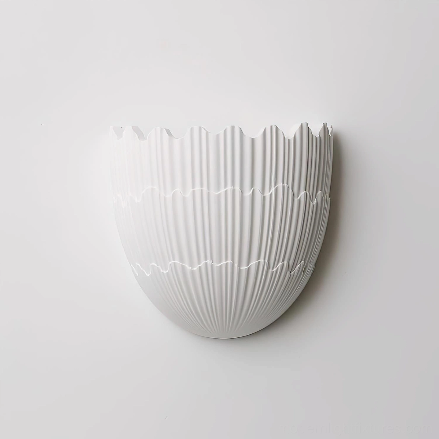 White matte ceramic Shellora sconce wall installation gallery display